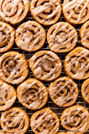 pumpkin cinnamon roll cookies with maple icing on top