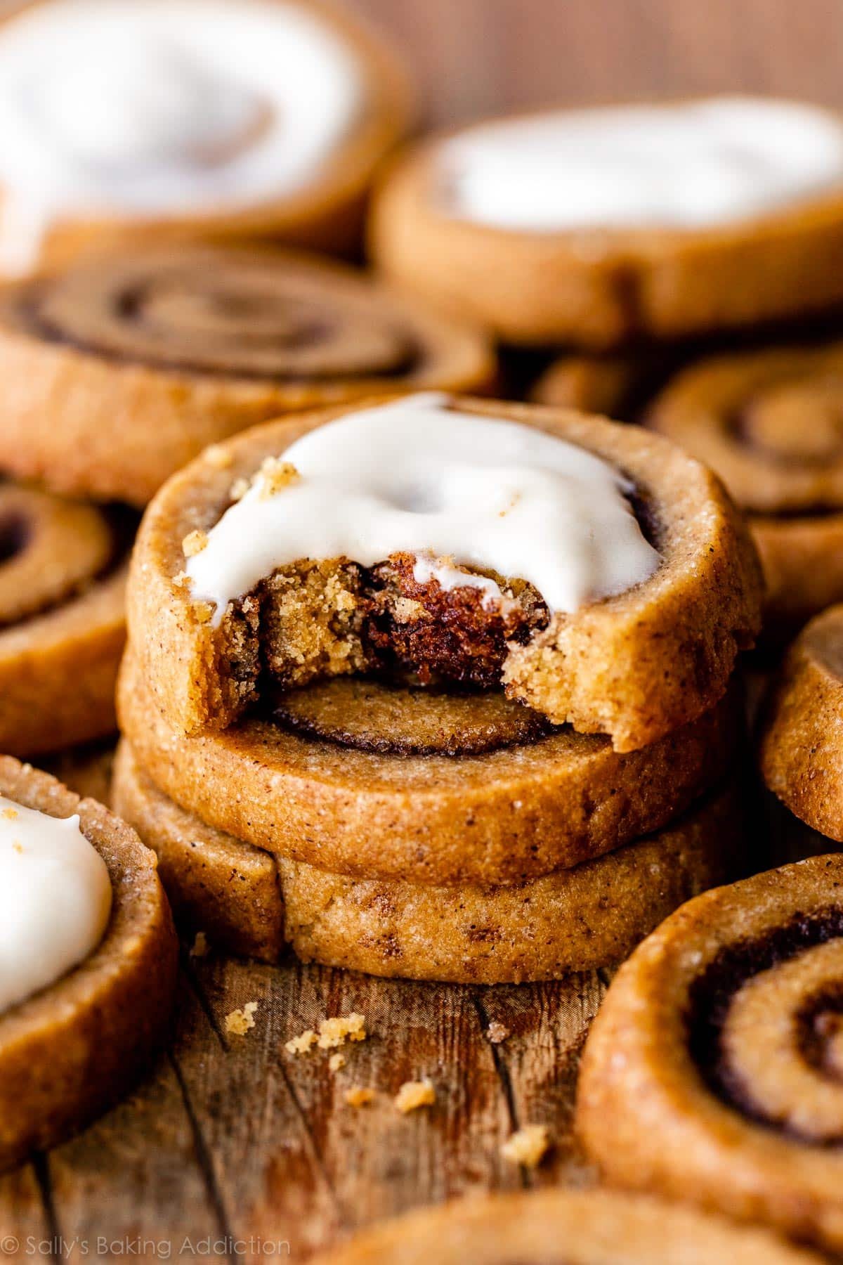 pumpkin cinnamon spice roll cookies with cream cheese icing on top