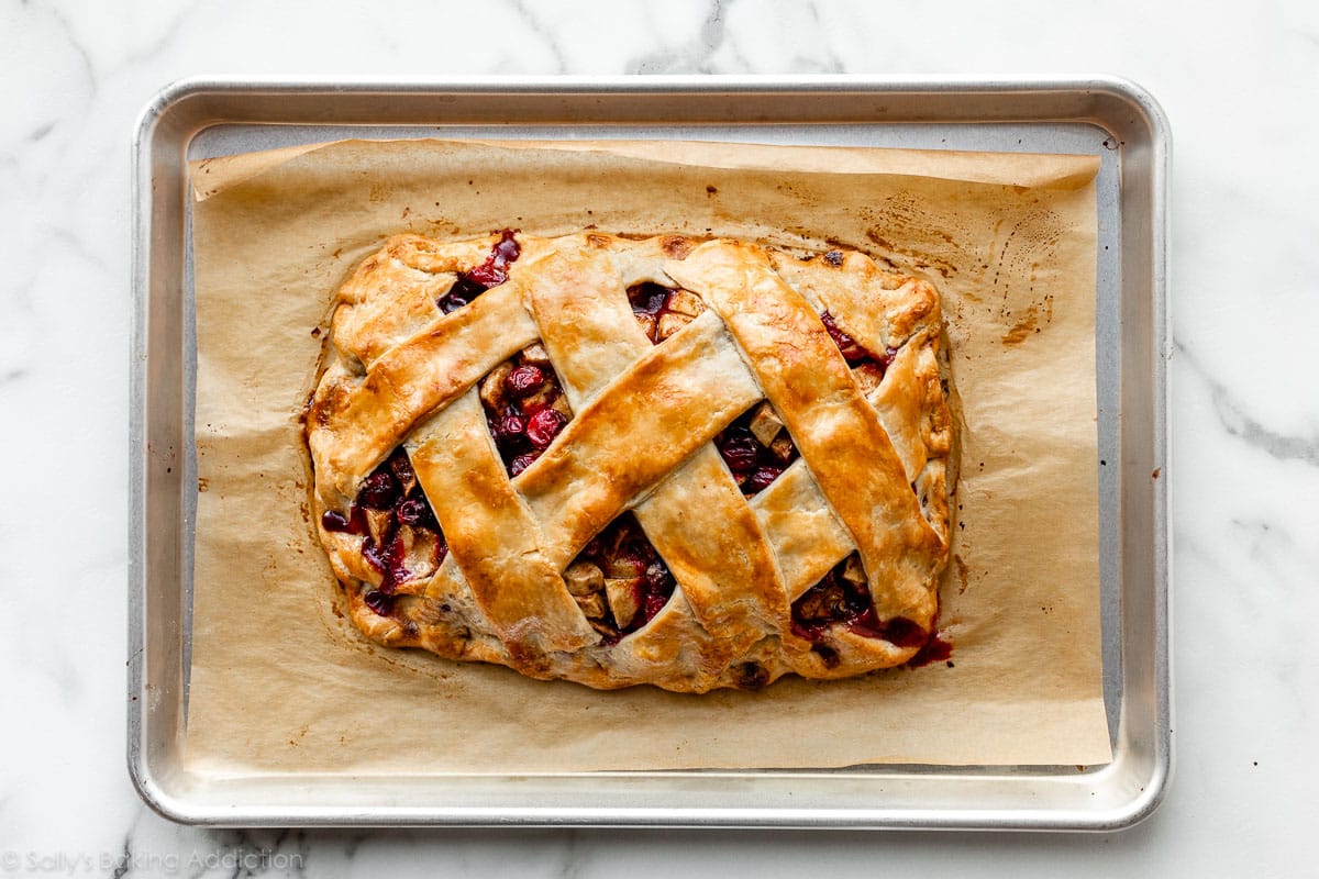apple cranberry slab pie with lattice crust on baking sheet