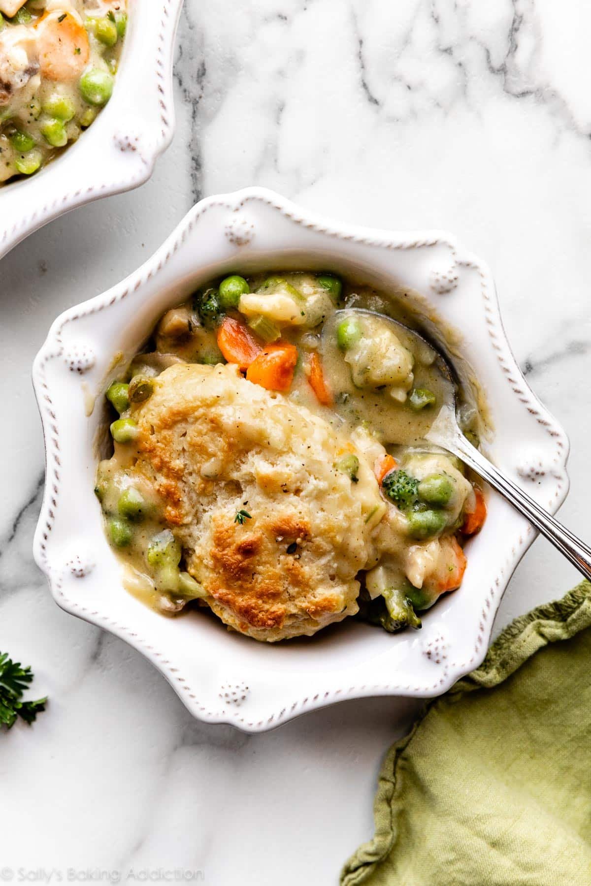 a serving of vegetarian vegetable pot pie with biscuit topping