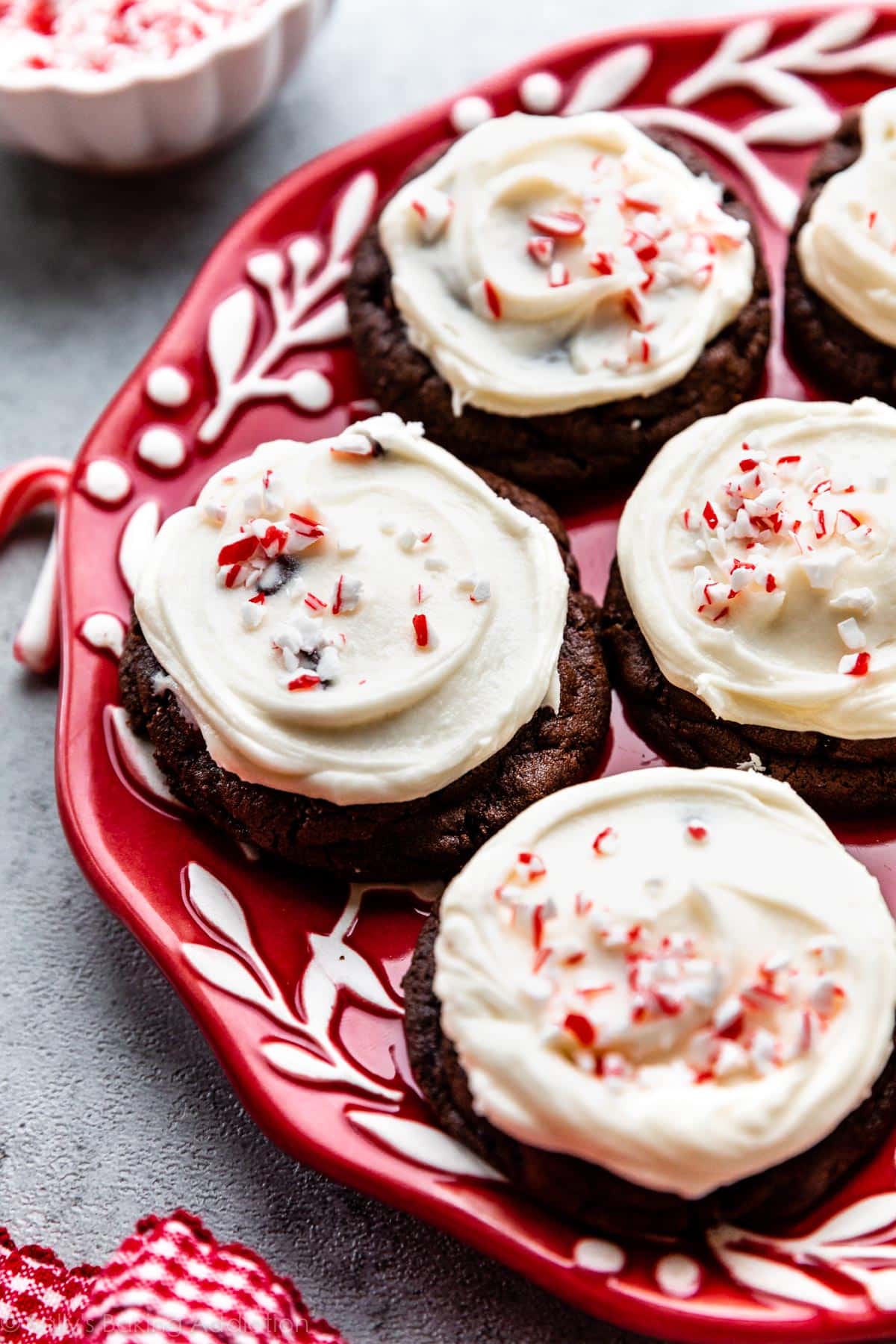 peppermint frosted chocolate cookies on red plate