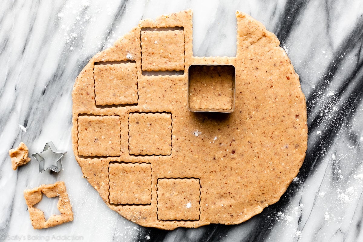 cutting hazelnut cookie dough into square shapes