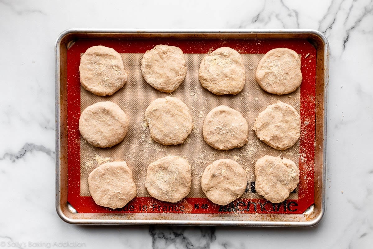 shaped English muffins on baking sheet before cooking