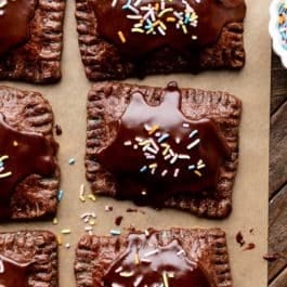 chocolate pastry pop tarts with icing and rainbow sprinkles