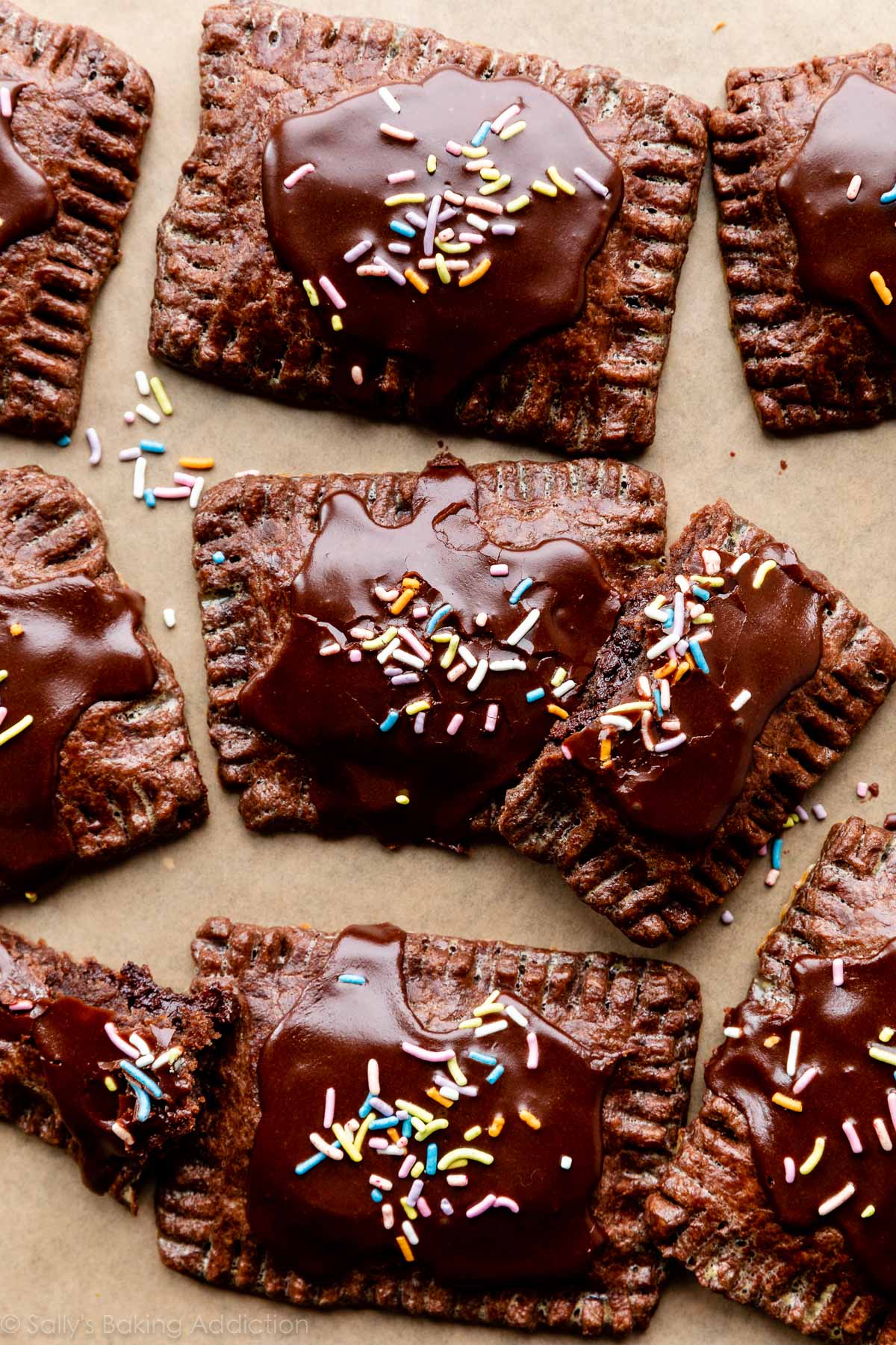 chocolate pastry pop tarts with icing and rainbow sprinkles