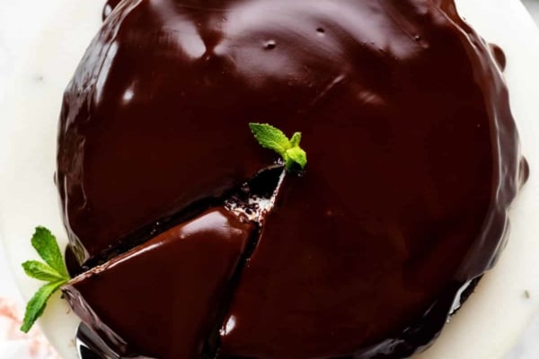 top of a ganache frosted chocolate cake