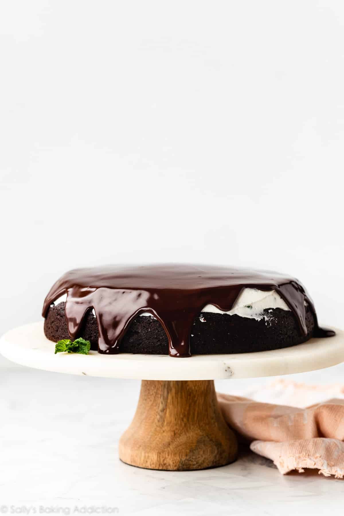 1 layer chocolate cake with mint buttercream and drip ganache on top