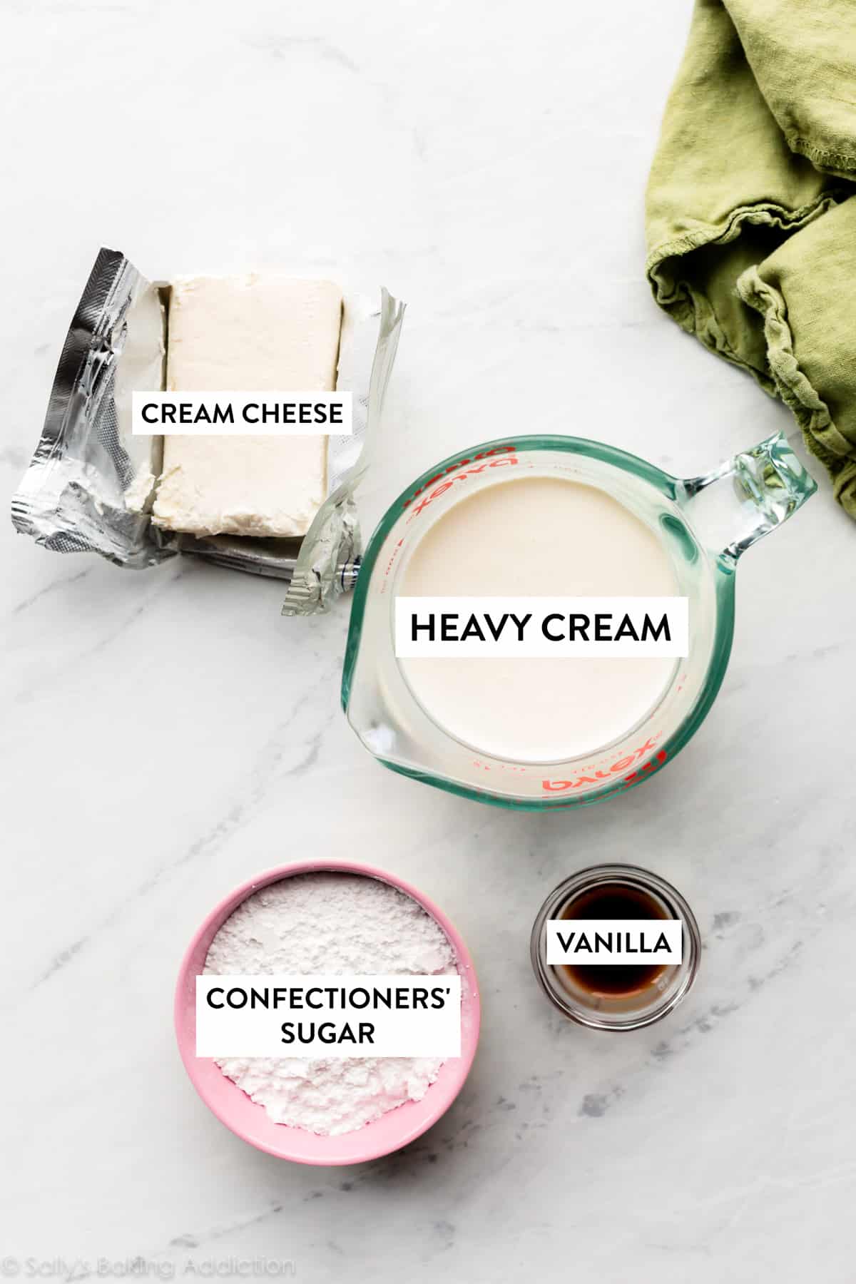 heavy cream, cream cheese, confectioners' sugar, and vanilla extract in bowls