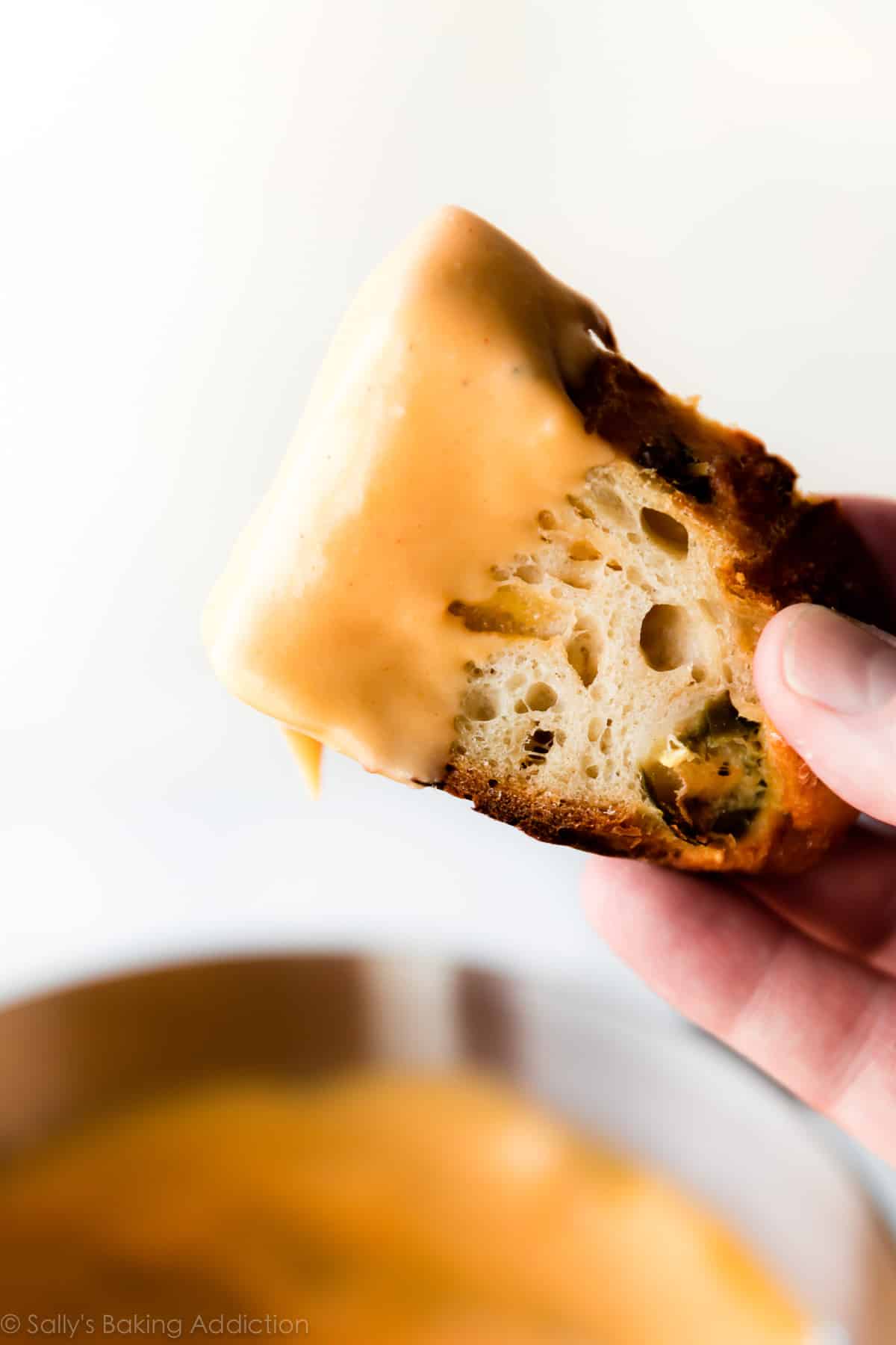jalapeno cheddar bread dipped in homemade nacho cheese sauce