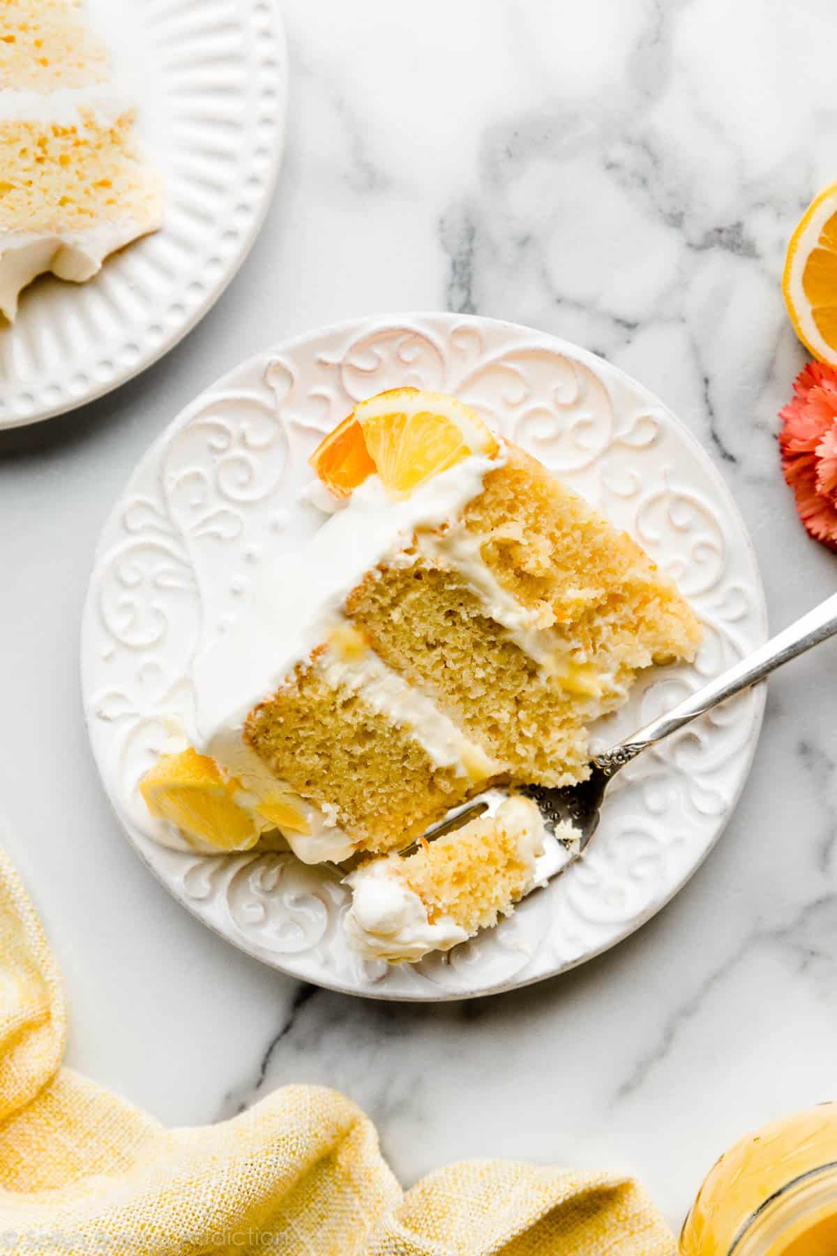 slice of citrus lemon orange lime cake on white plate