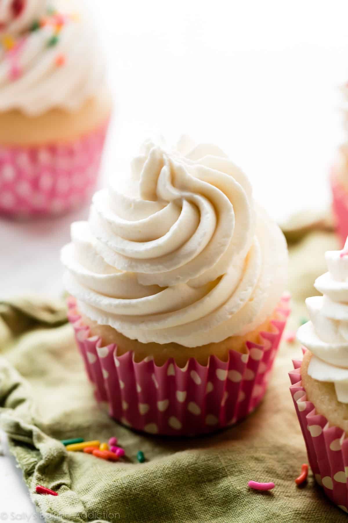 whipped frosting piped on cupcake