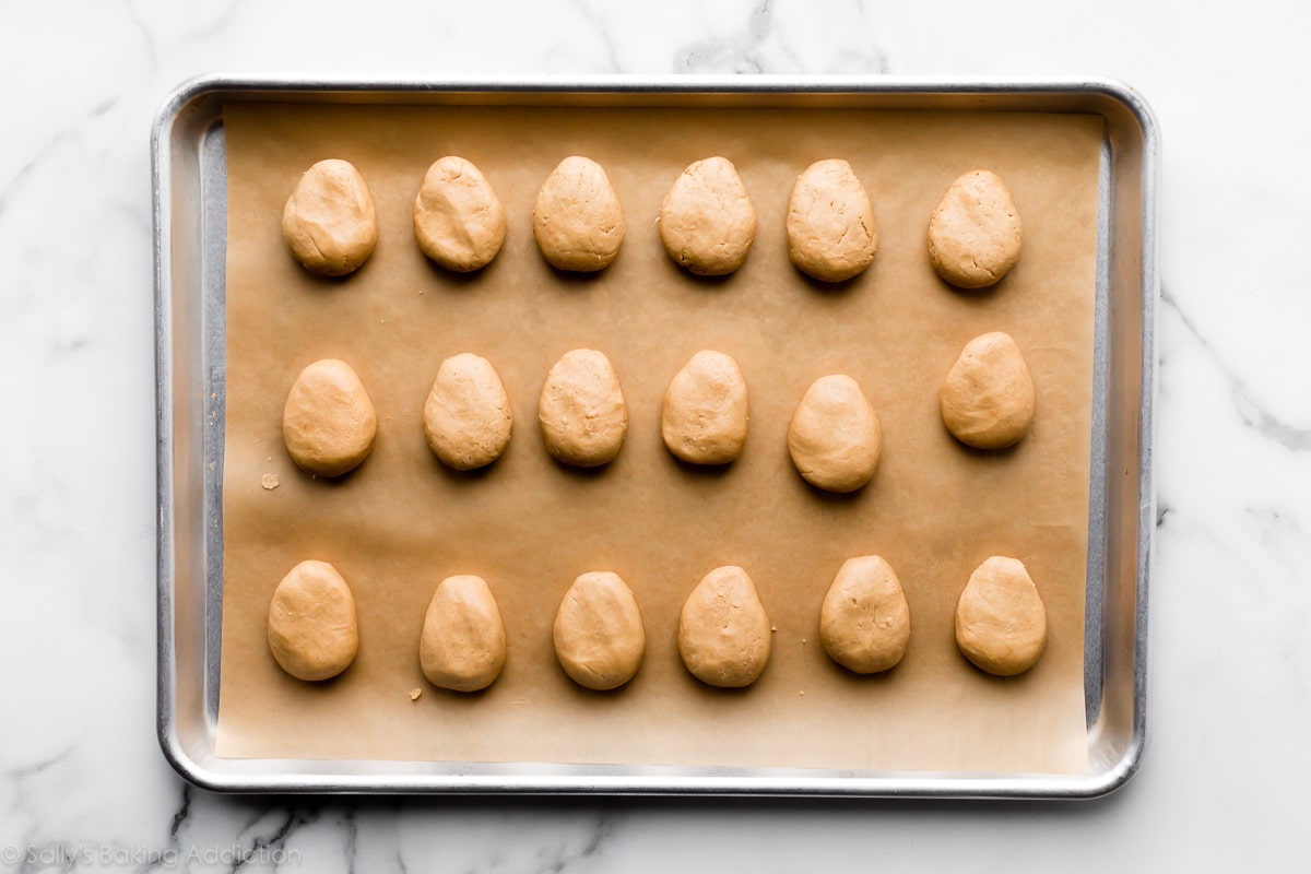 egg shaped peanut butter candies on baking sheet