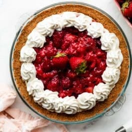 strawberry cream cheese pie with whipped cream piped on top