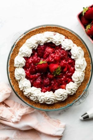 strawberry cream cheese pie with whipped cream piped on top