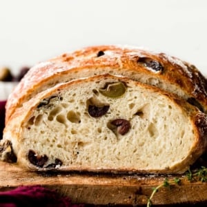 olive bread sliced from boule loaf