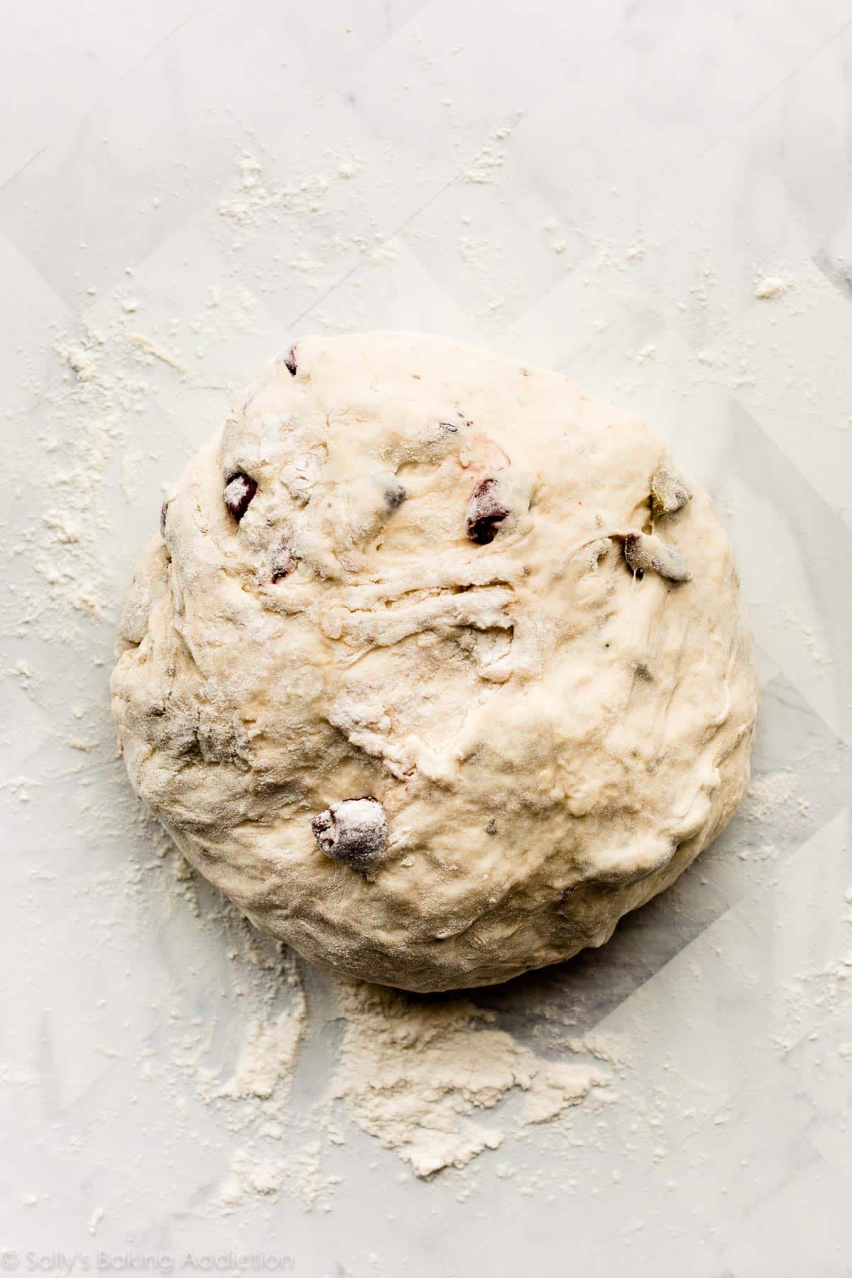olive bread dough on floured counter