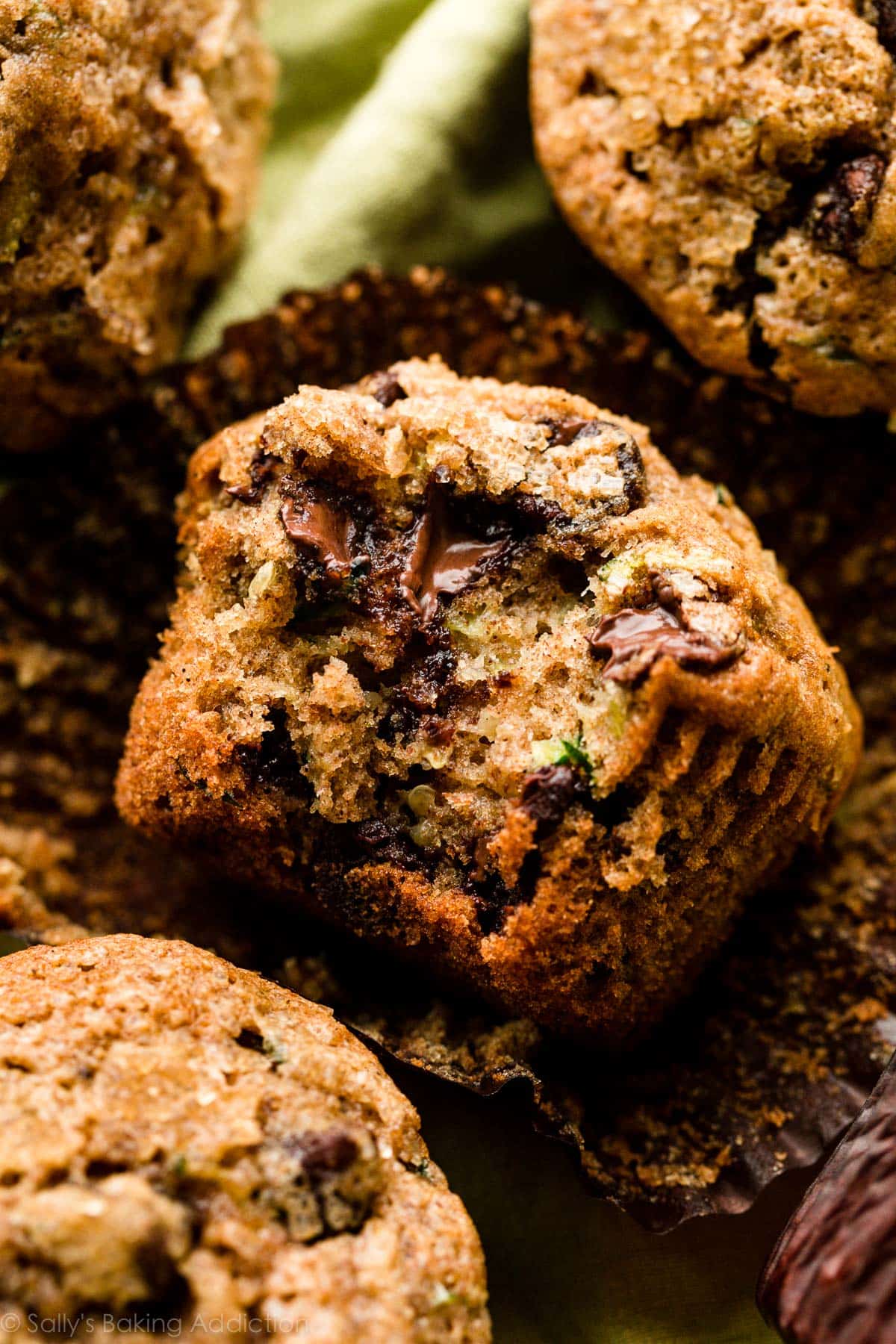 chocolate chip zucchini muffin with bite taken out