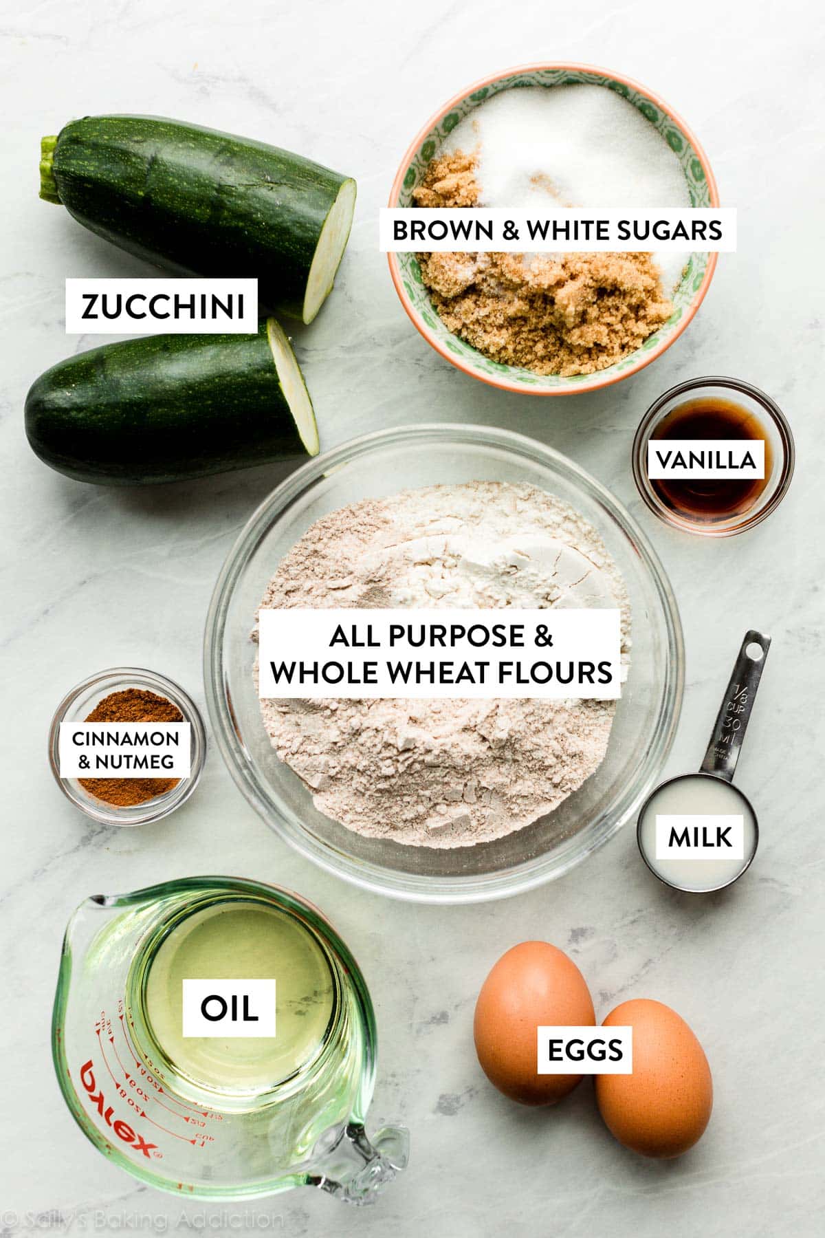 whole wheat flour and other ingredients including eggs, milk, oil, and zucchini