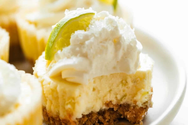 mini margarita cheesecakes with tequila whipped cream.