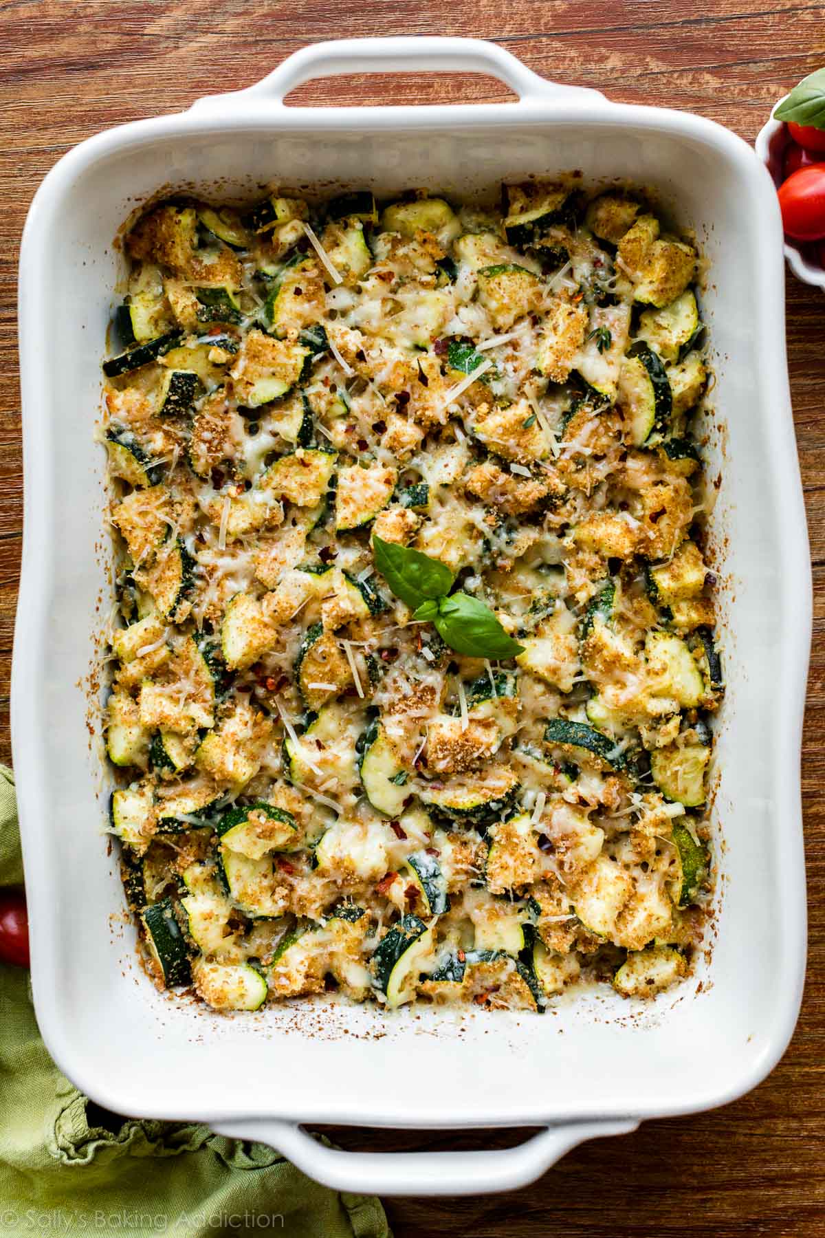 zucchini and feta side dish with breadcrumbs, basil, and fresh parmesan cheese on top