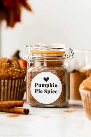 small jar of pumpkin pie spice with white label on the front.
