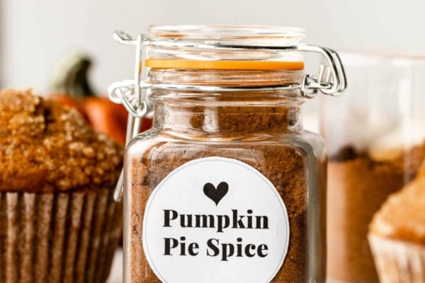 small jar of pumpkin pie spice with white label on the front.