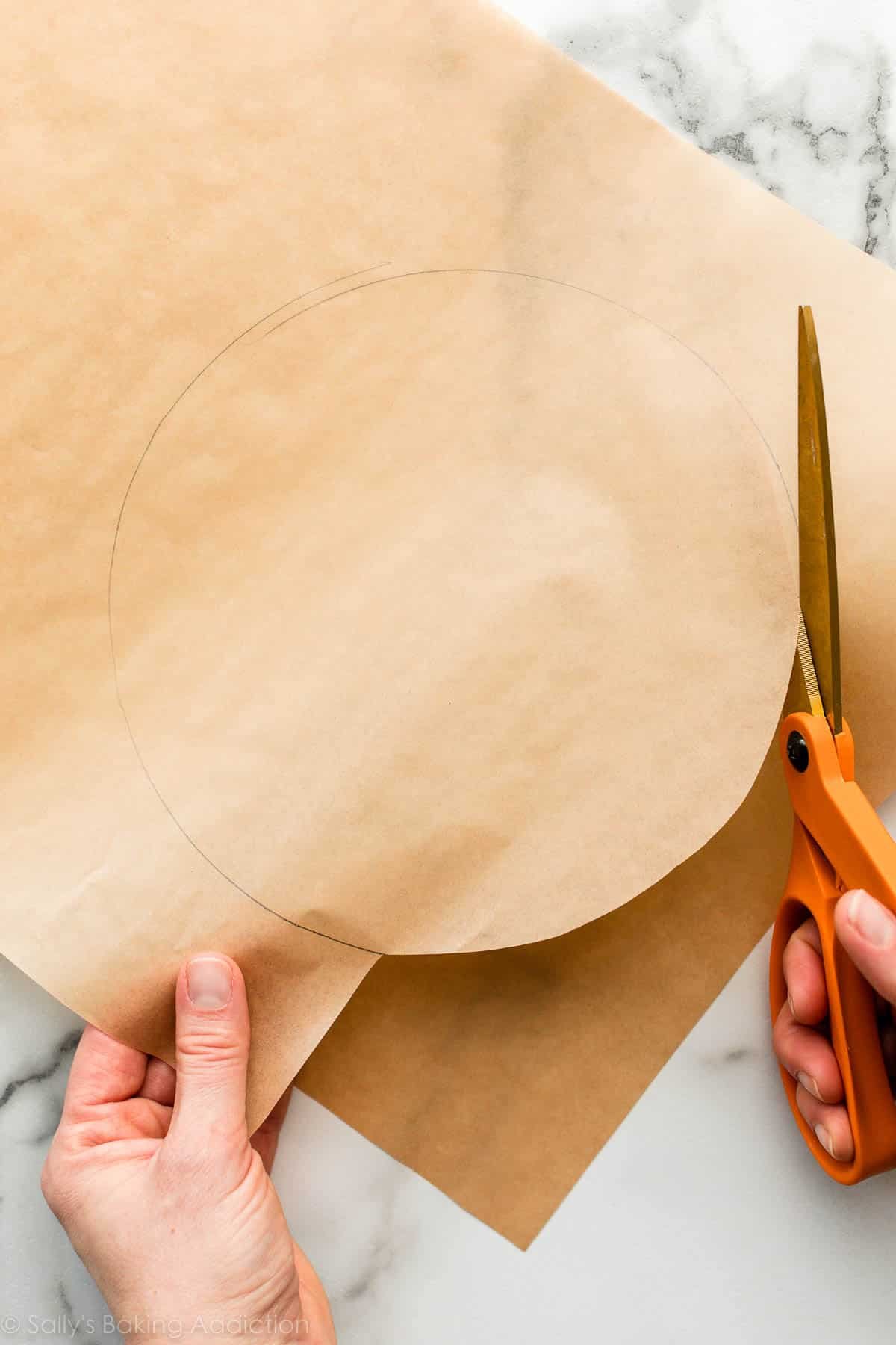 cutting out a circle of parchment paper.