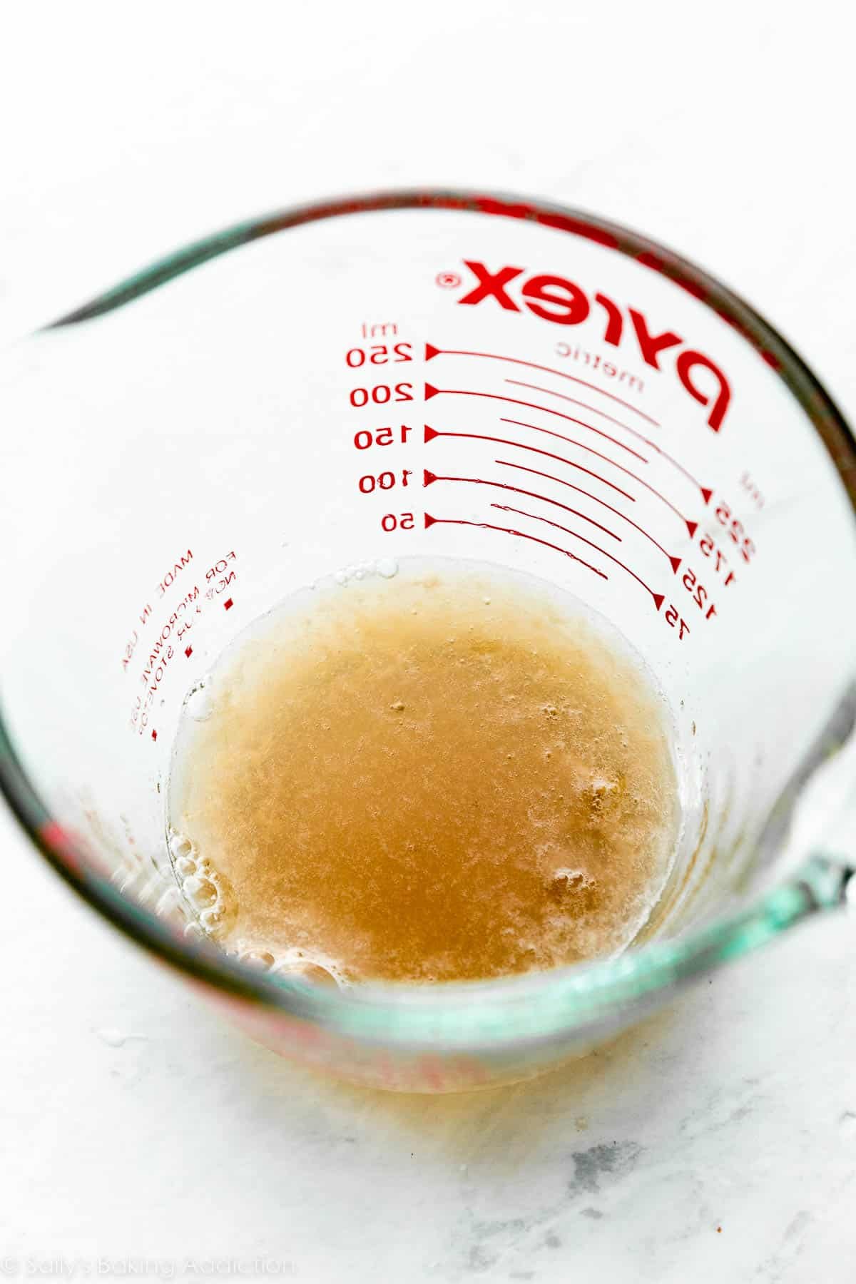 brown liquid in liquid measuring cup.