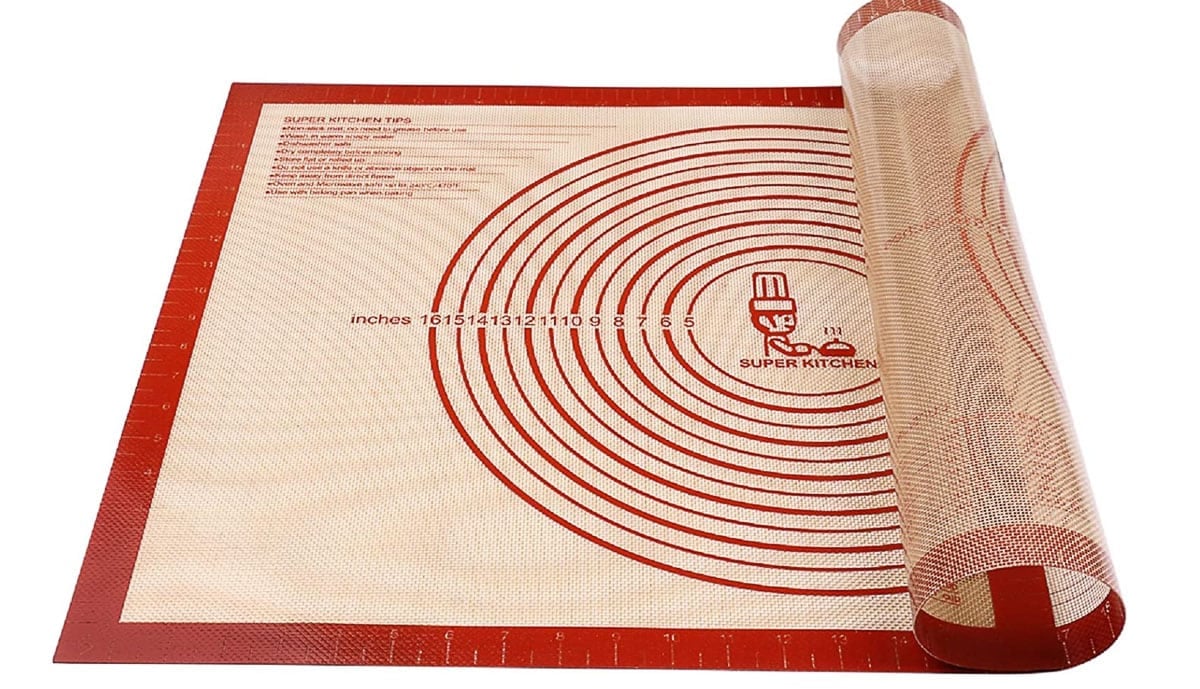 image of a silicone pastry mat halfway rolled up.