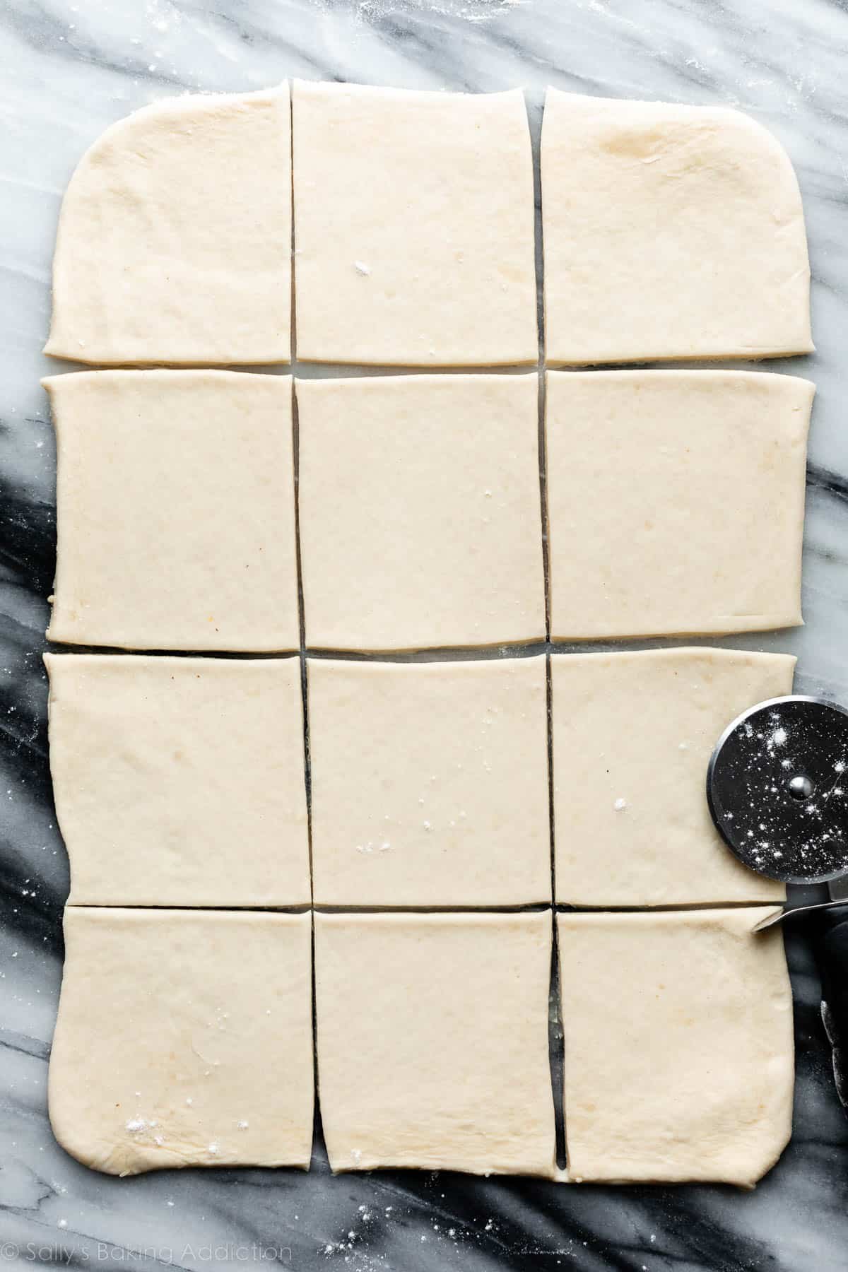 rolled out and cut homemade puff pastry dough, shaped into squares.