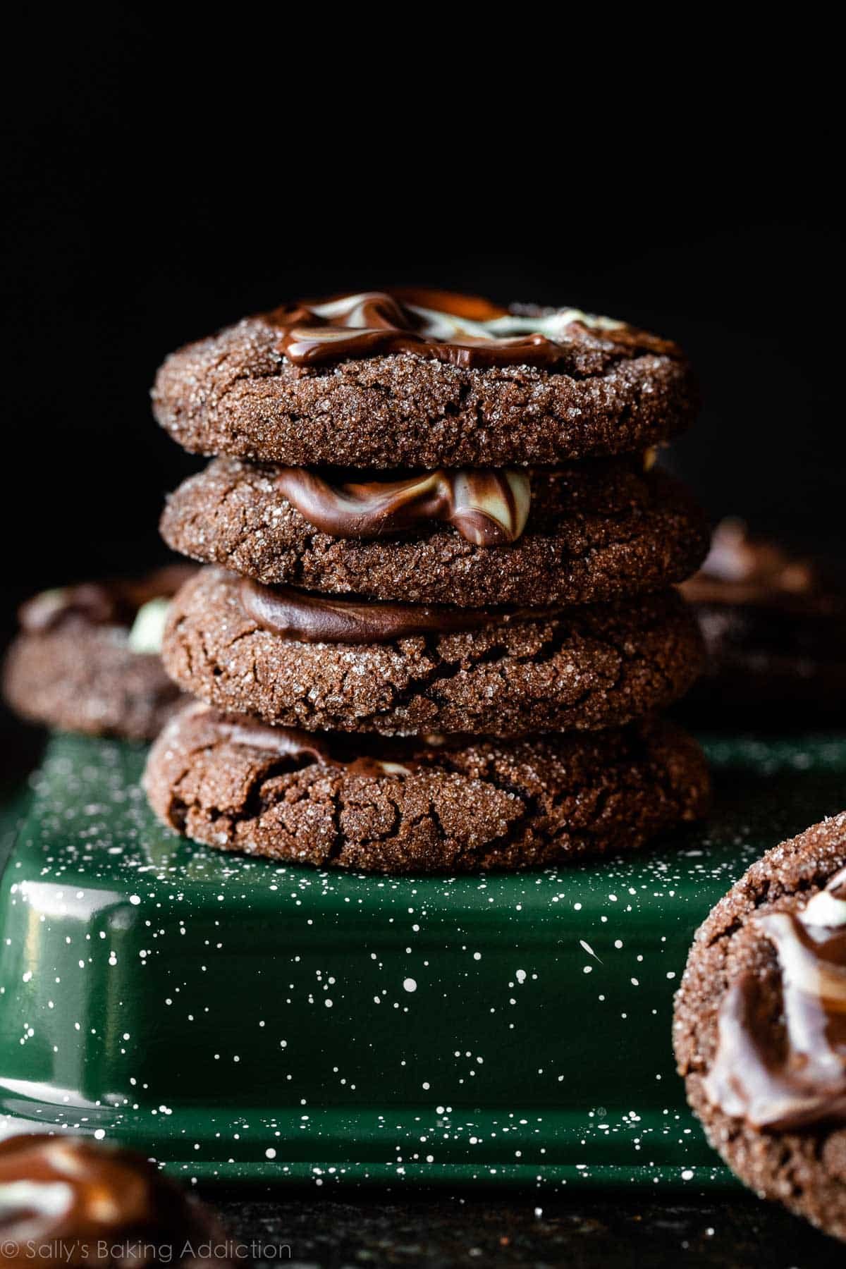 stack of 4 chocolate cookies topped with melted Andes chocolate mint.