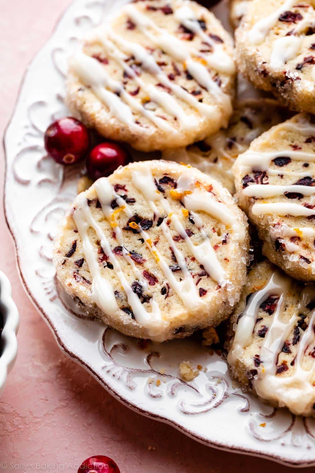 place of cranberry orange cookies with icing drizzled on top of each.