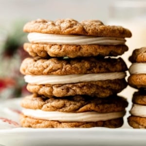 close-up photo of stack of 3 eggnog oatmeal cream pie cookies.