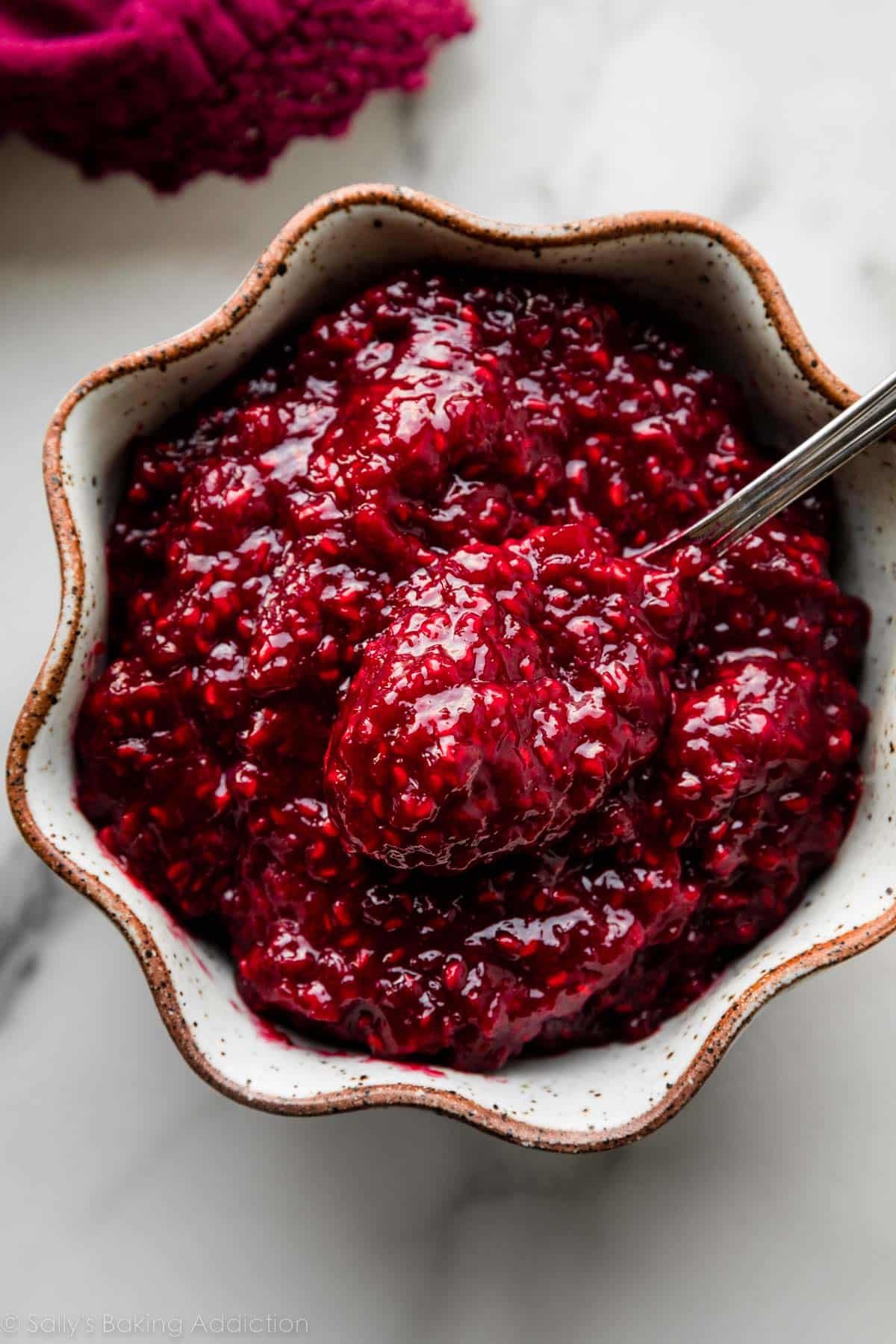 bowl of thickened raspberry sauce filling.