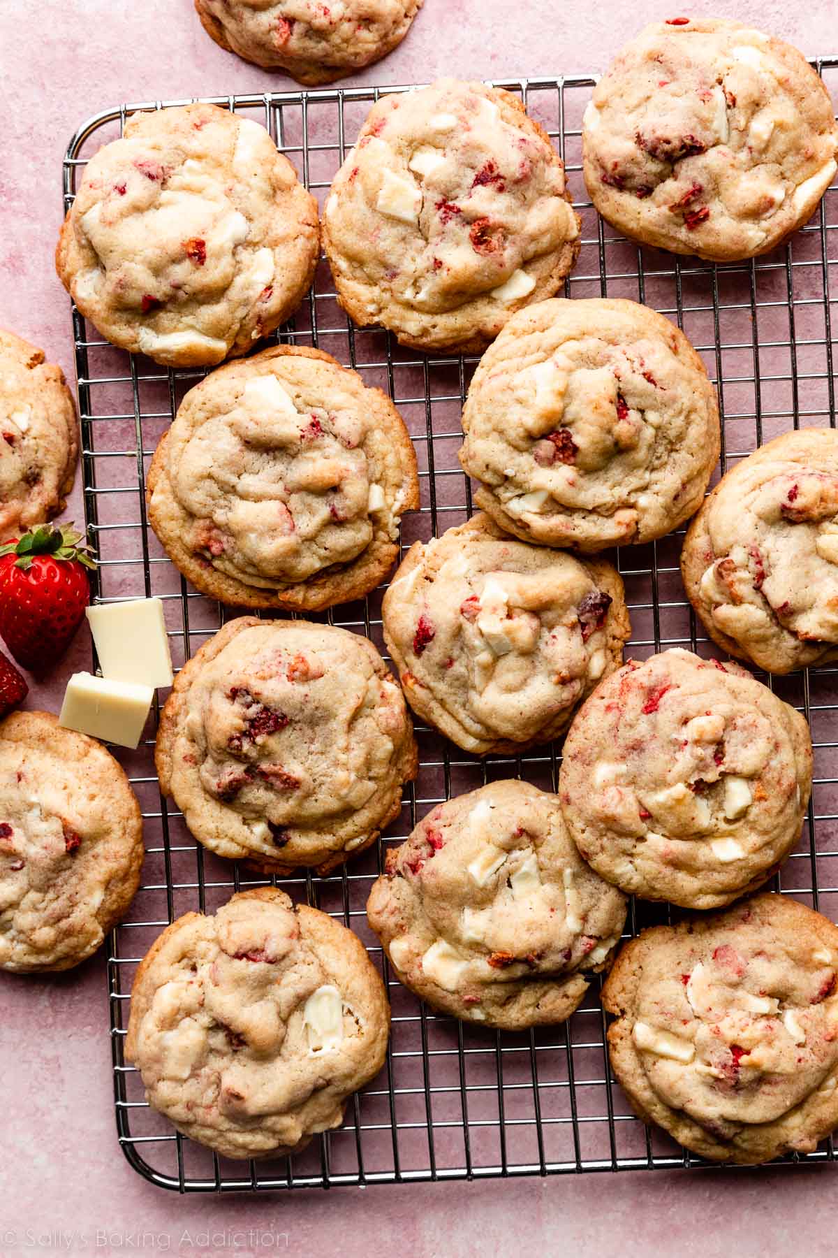 strawberry and white chocolate cookies on wire cooling rack.