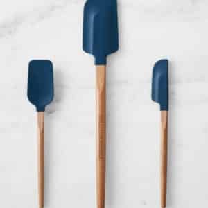 3 navy and wood silicone spatulas.