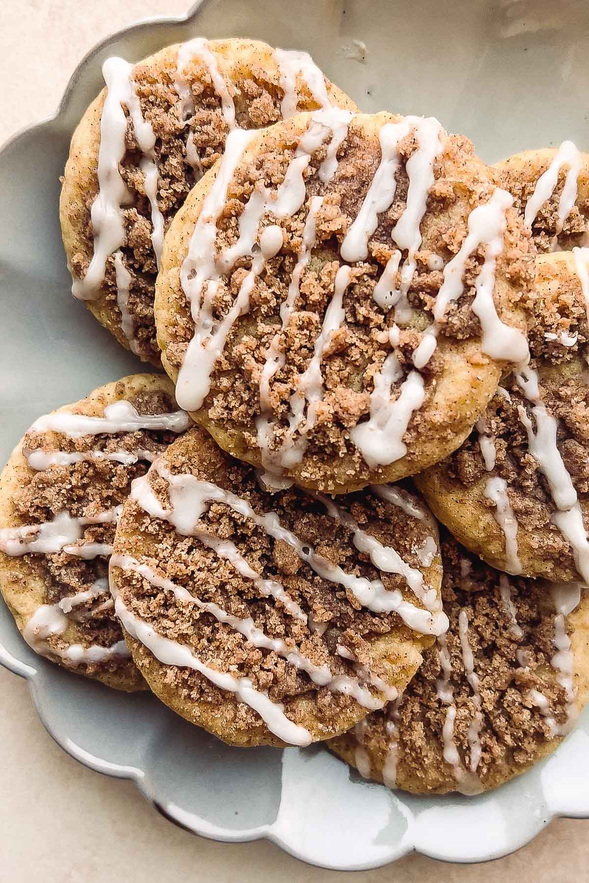 crumb cake style cookies with icing on top.