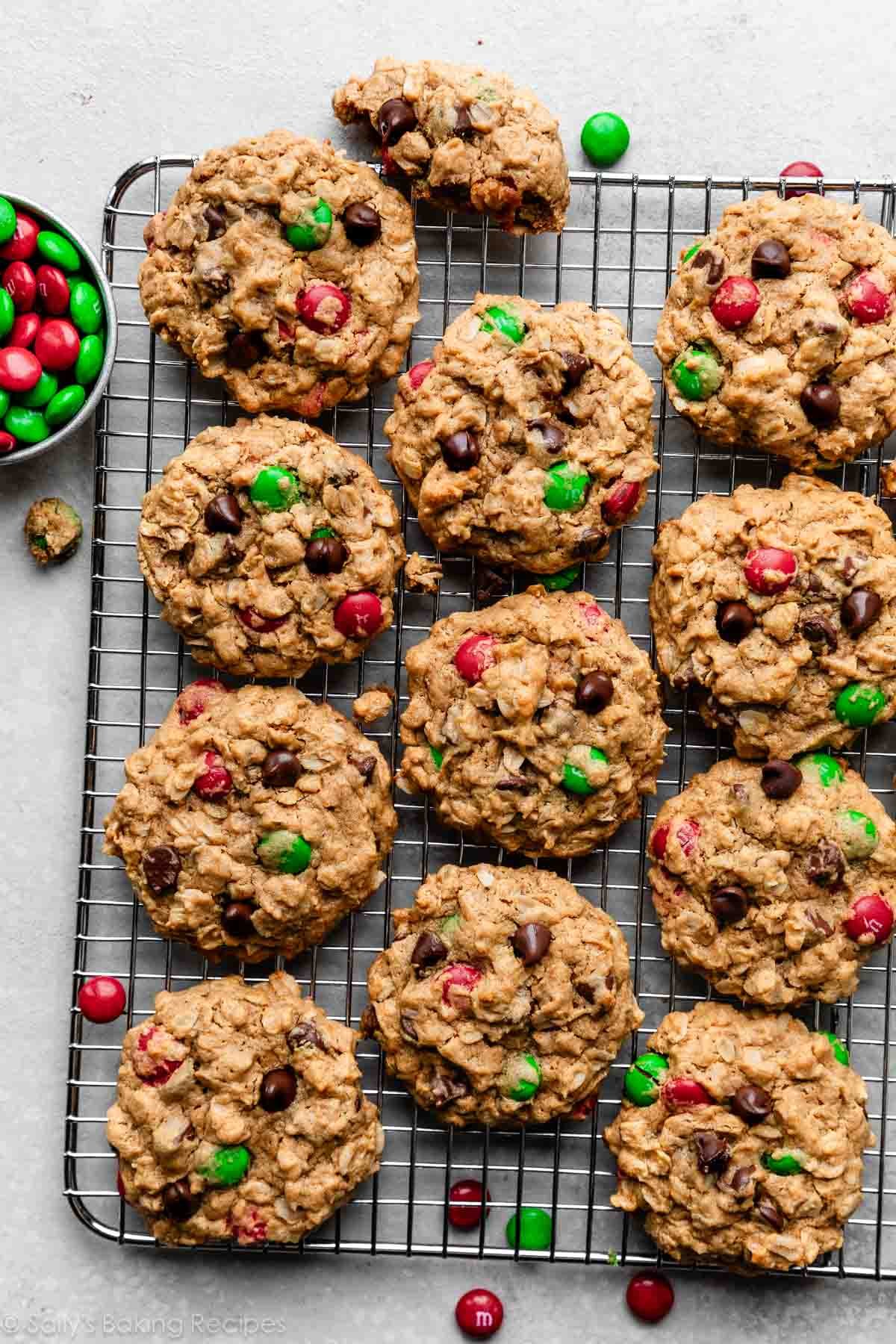 monster Christmas-colored M&M peanut butter oatmeal cookies on wire cooling rack.