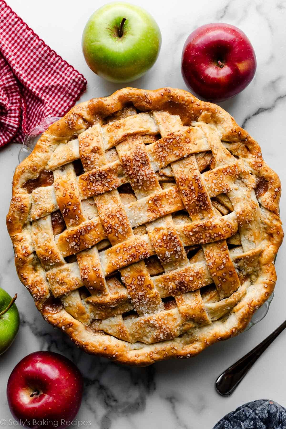 apple pie with fluted pie crust edge and lattice pie crust topping.