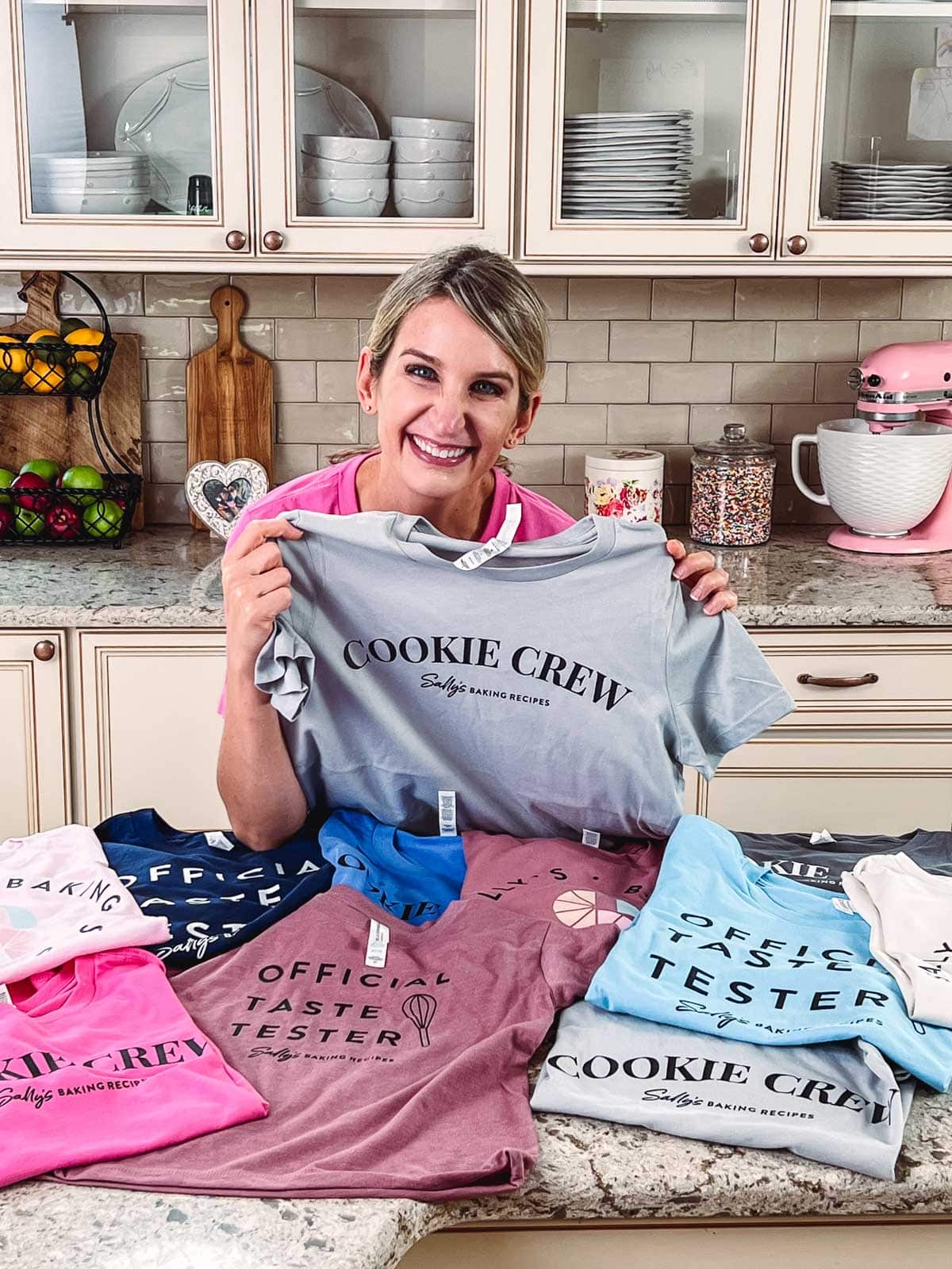Sally with colorful Sally's Baking Recipes shirts.
