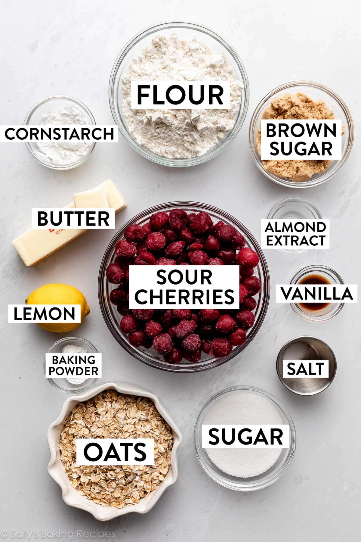 measured ingredients on counter including sour cherries, flour, brown sugar, butter, oats, sugar, and salt.
