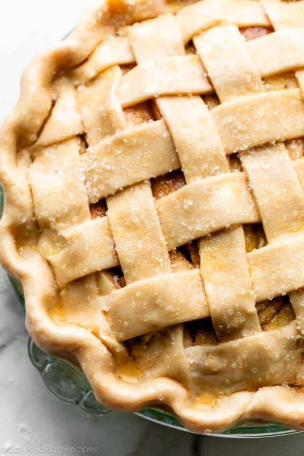 lattice pie crust with egg wash and coarse sugar on top.