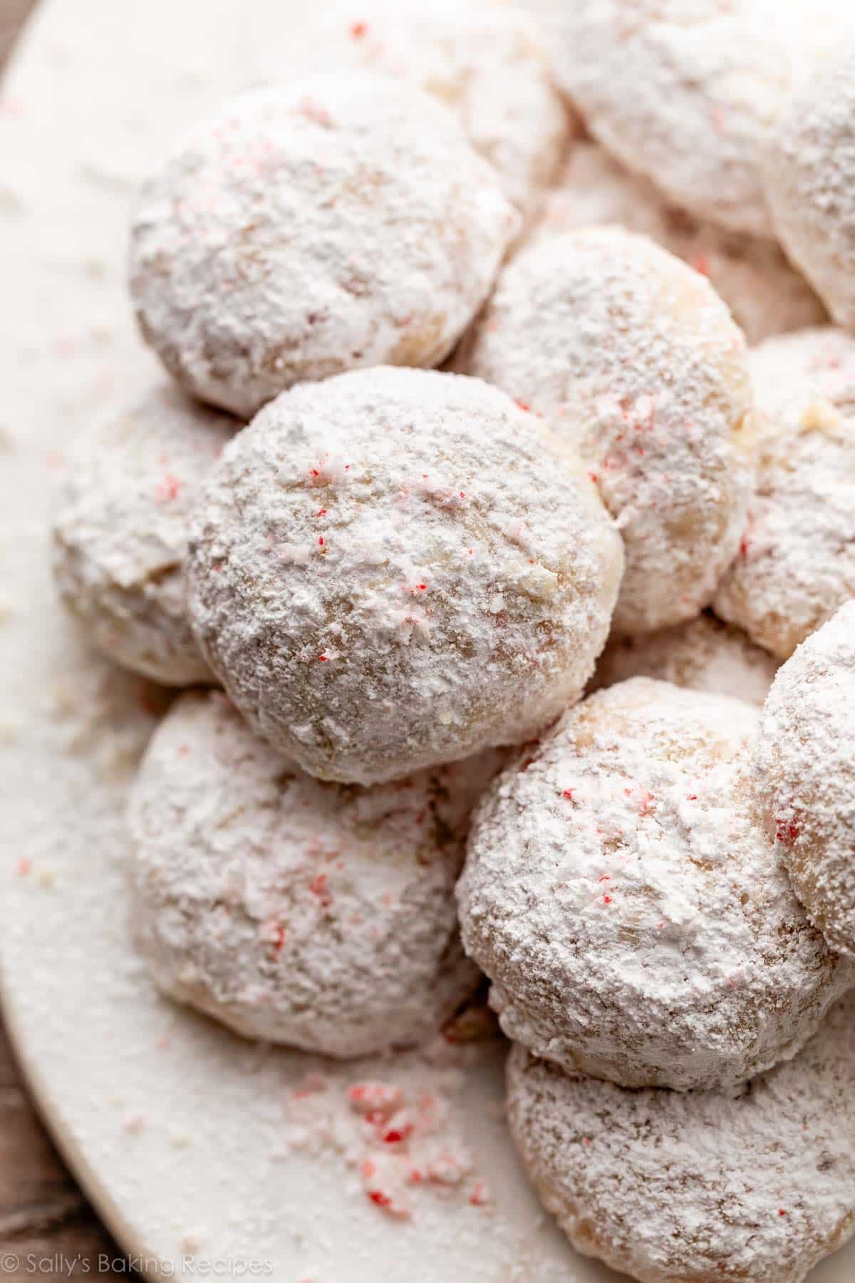 peppermint snowball cookies with candy cane pieces.