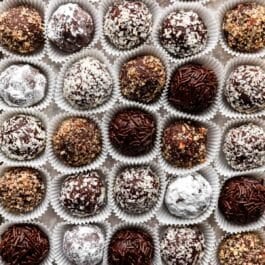 overhead close-up shot of rum balls coated in various toppings.