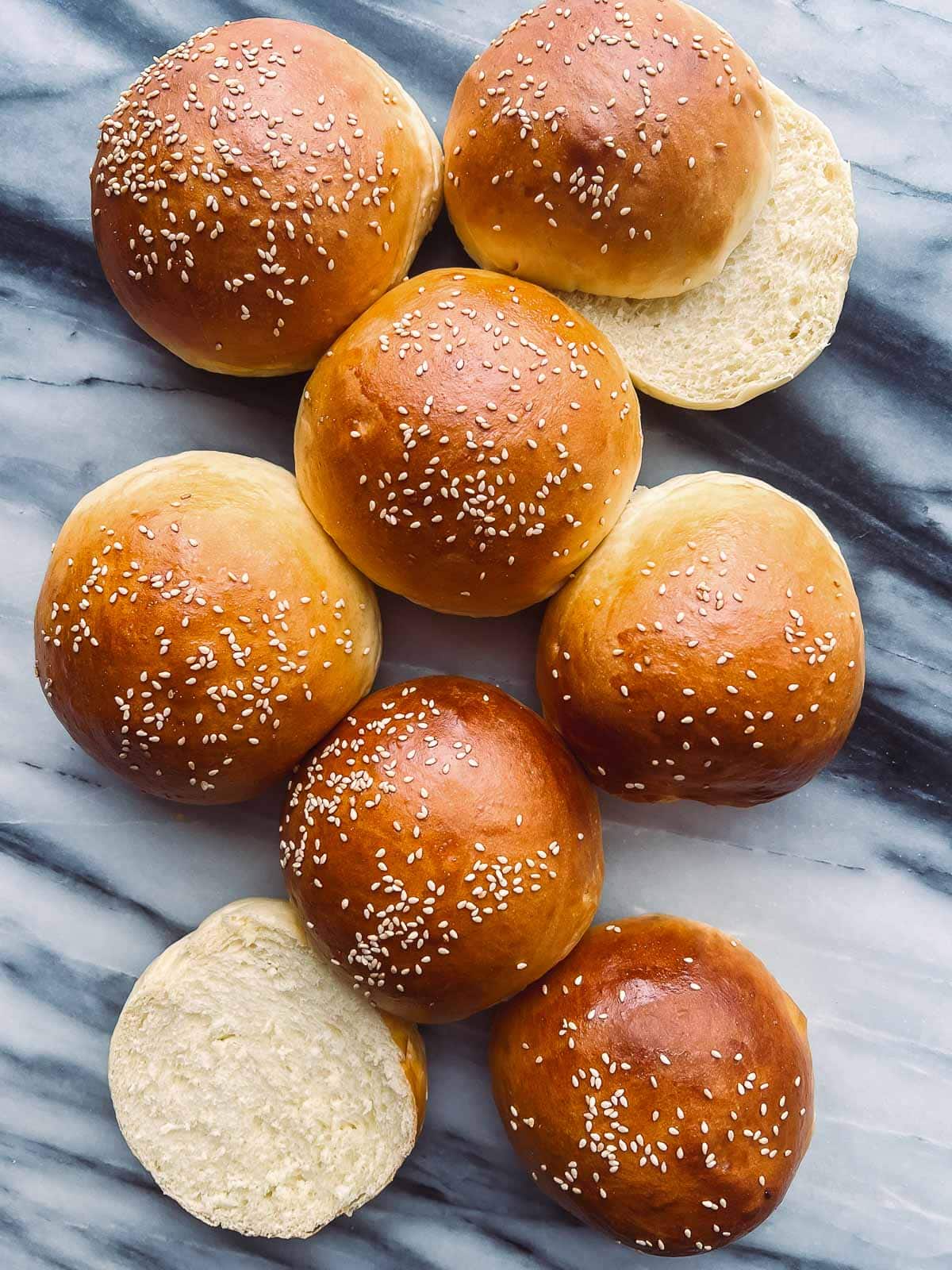 brioche-style buns with sesame seeds.