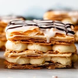straight on photo of 3 layered puff pastry and pastry cream layers.