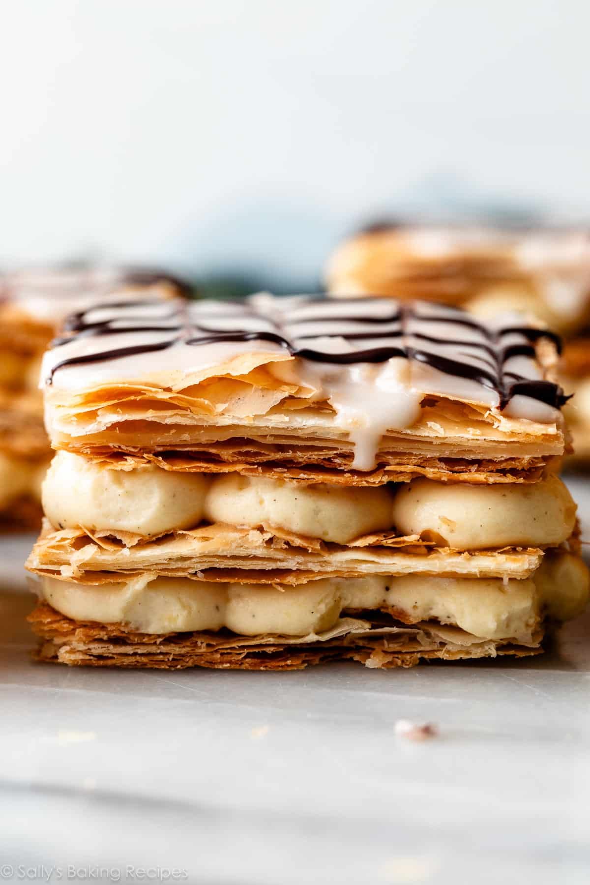 straight on photo of 3 layered puff pastry and pastry cream layers.