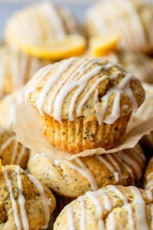 close-up of lemon poppy seed muffin with icing on top.
