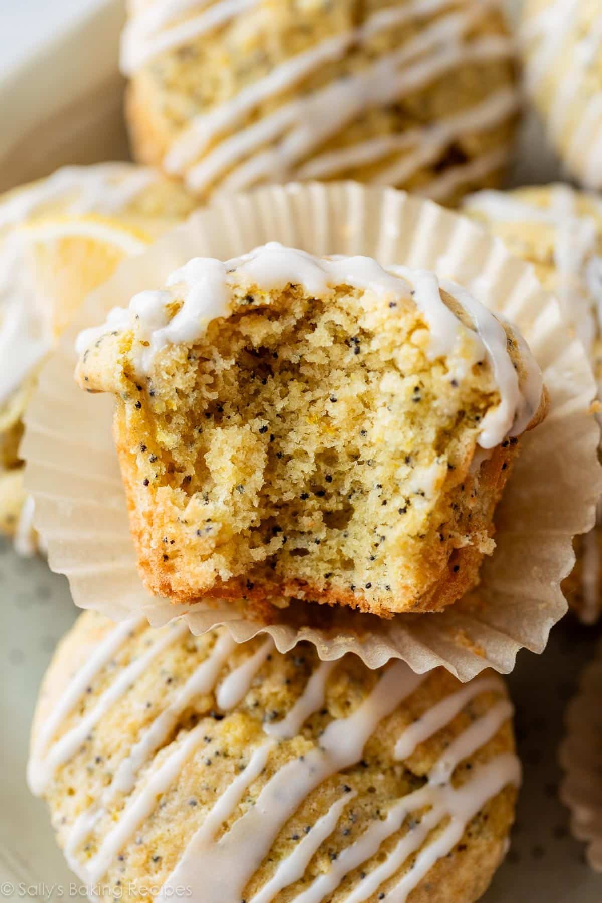 close-up of lemon poppy seed muffin with bite taken out.