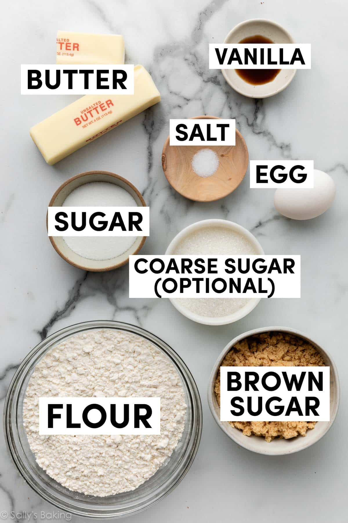 ingredients measured in bowls on marble counter.
